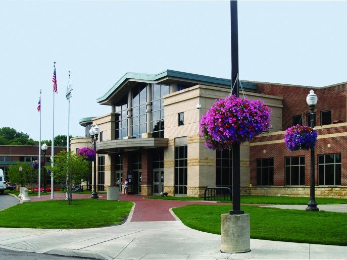 Community Center exterior entrance with flower baskets