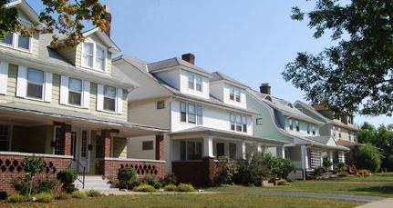 A row of large duplex-type houses.