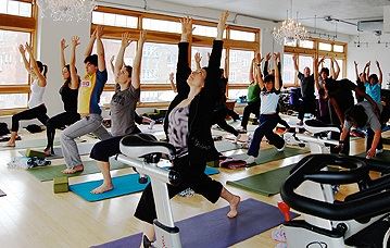 People doing yoga in a class.